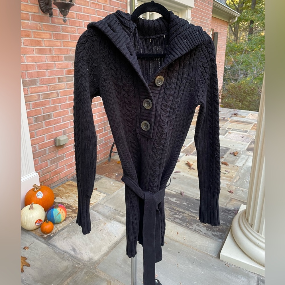 Black sweater coat with belt.